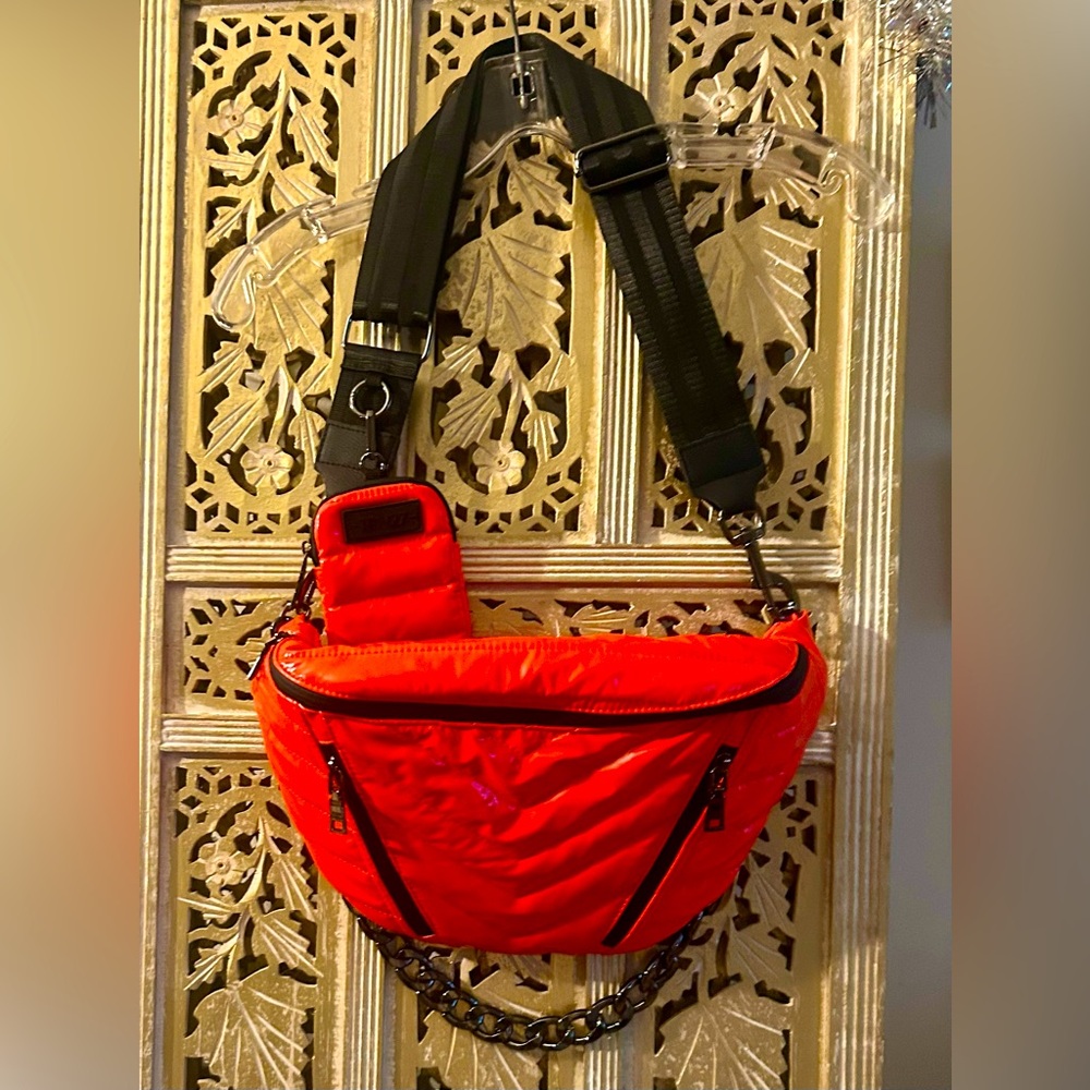 THINK ROYLN sling bag in shiny orange slingshot on the go chain + strap summer
